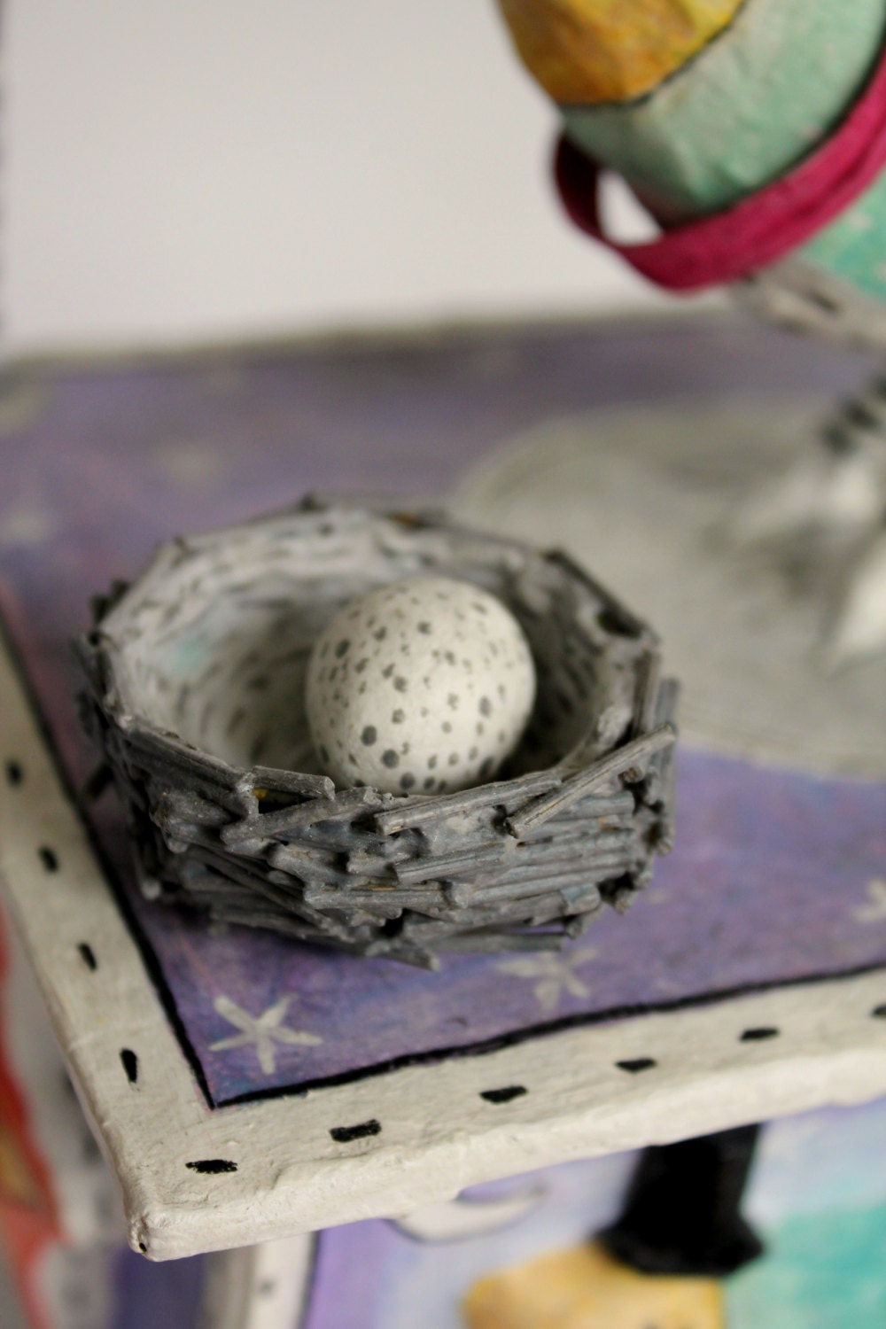 Papier mache box bird sculpture. Bird with warm by