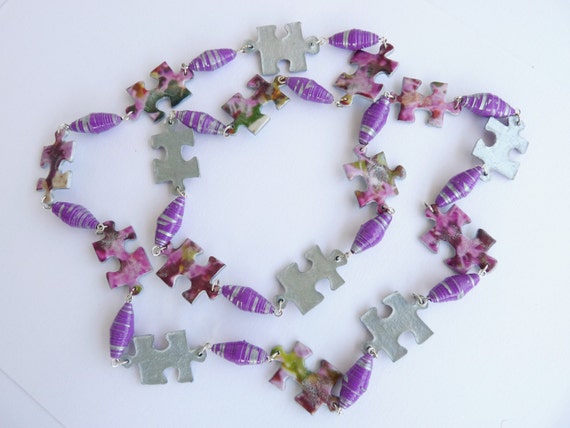 Items similar to Silver jigsaw puzzle necklace on Etsy