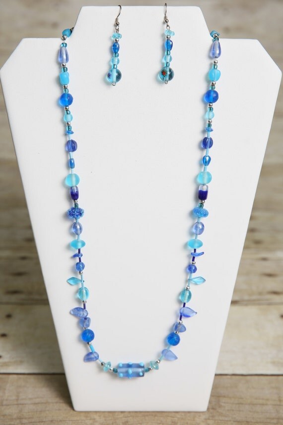 Items similar to Shades of Blue Glass Beaded Necklace and Earrings