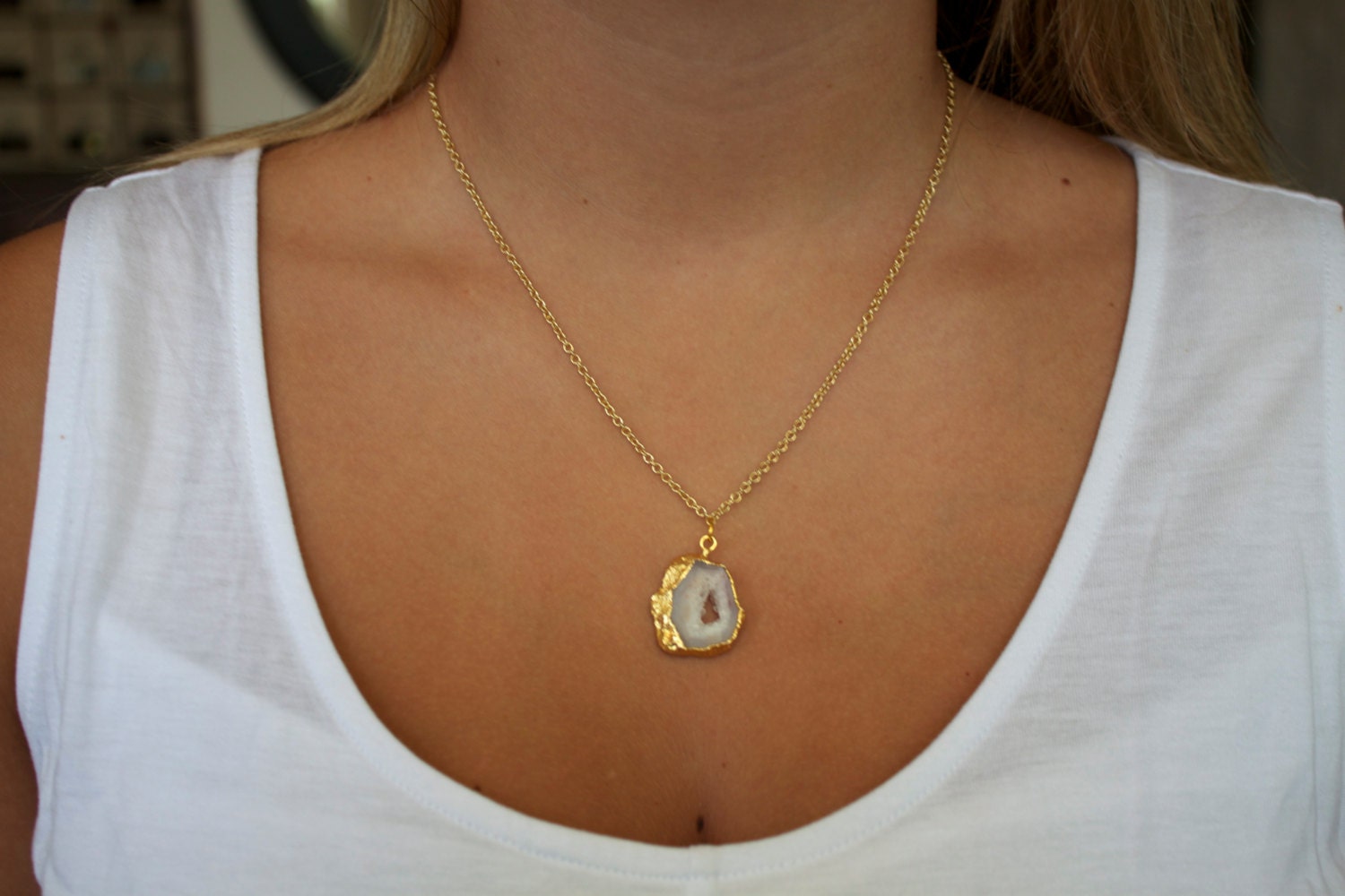 Delicate gold choker with a small sliced geode pendant