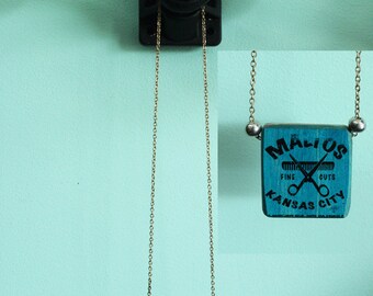 Necklace made with recycled skateboard