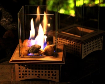 Tabletop Glass Fireplace, This indoor/outdoor lantern can add light to your patio and roast S'mores, too!
