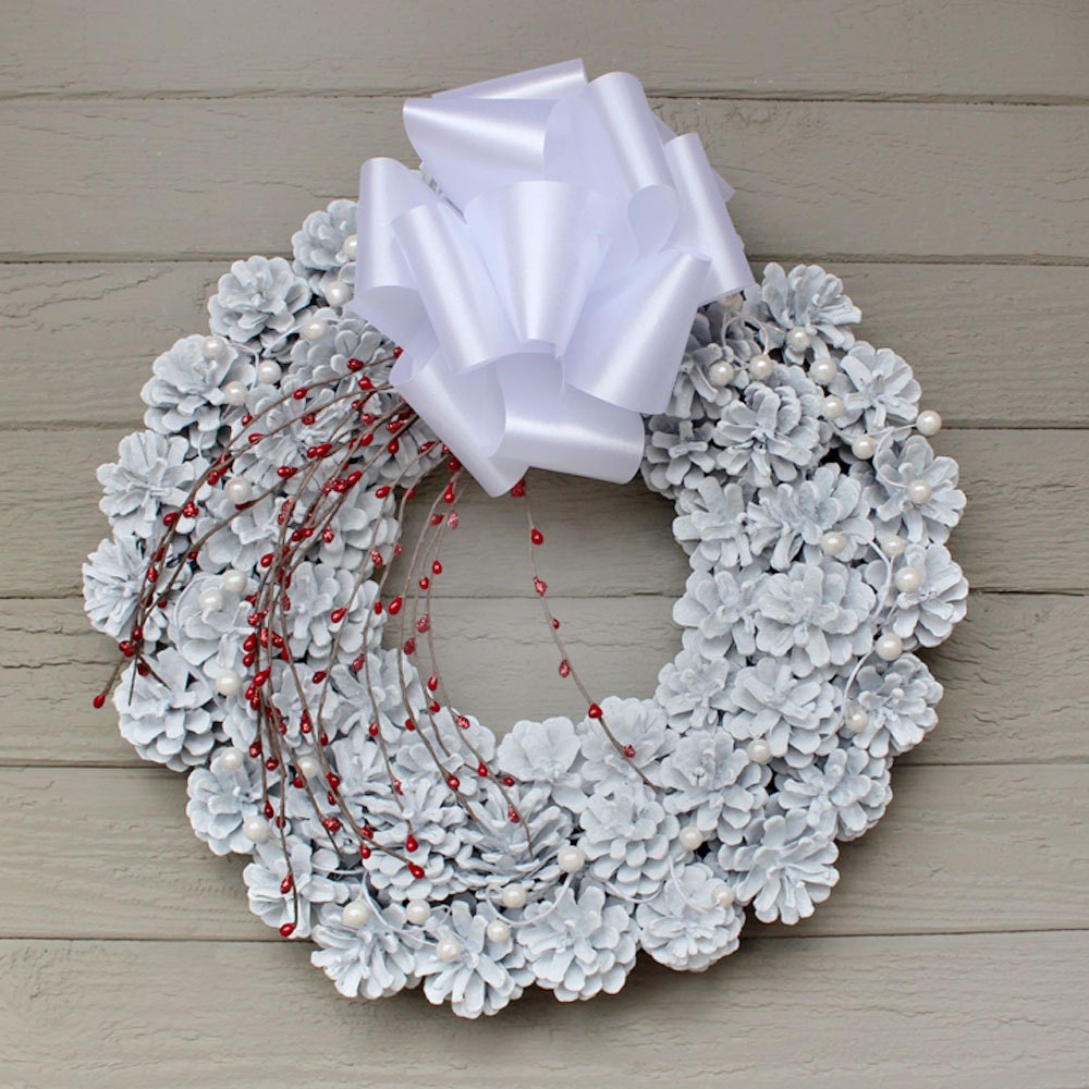 white glitter pinecone wreath white berries red by white glitter pinecone wreath white berries red by
