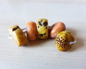 Faux Ancients in Ivory/Amber/Bone. Polymer clay artisan wheel beads.