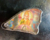 Krishna beach glass charm with solder and ephemera.