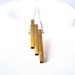 Modern Jewelry. Long Gold Bar Necklace on Silver Chain.