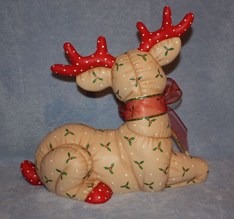 white and gold ceramic reindeer