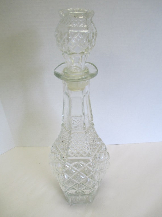 Vintage glass whiskey decanter with seal stopper. used.