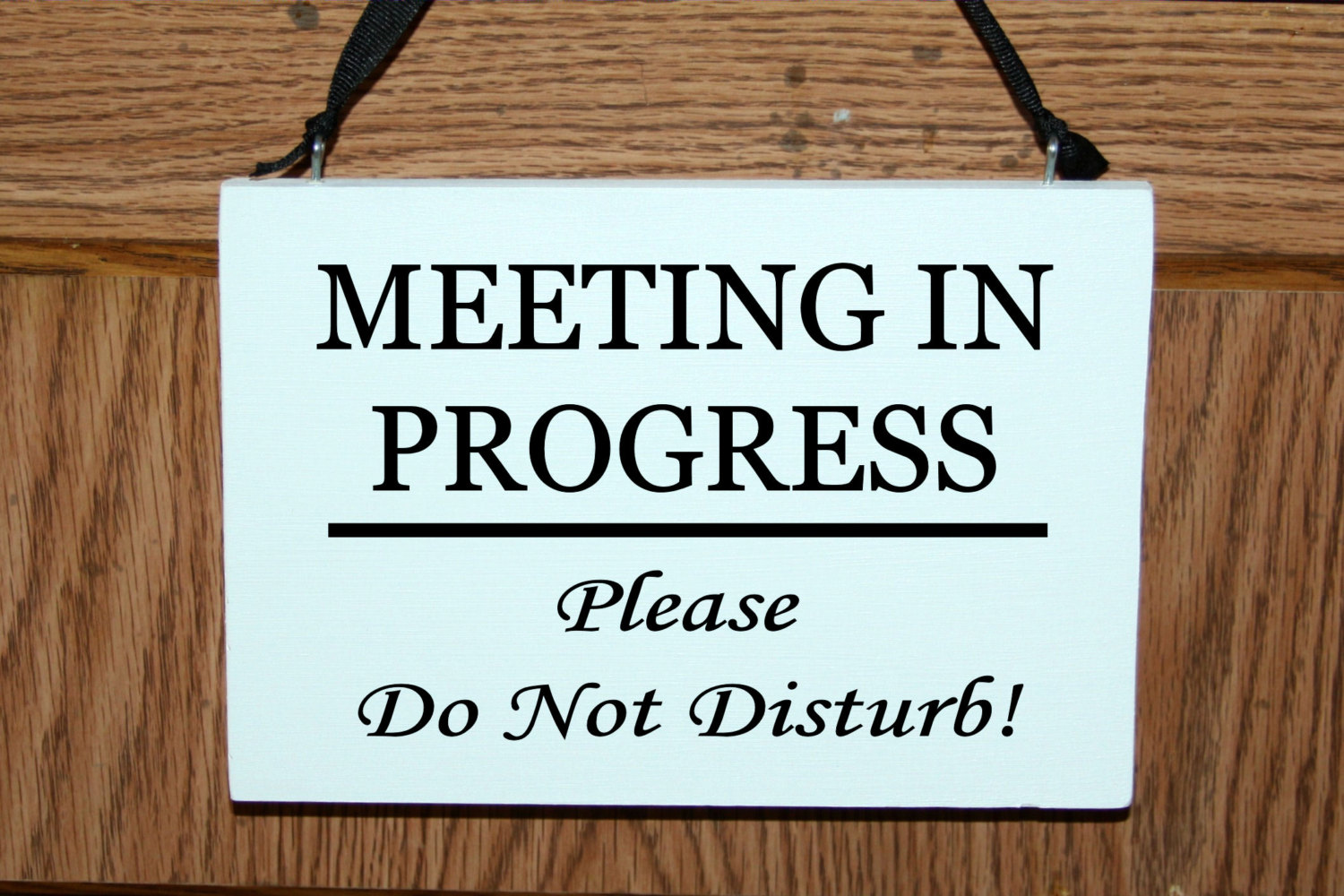 Meeting in progress please do not disturb wood door hanger