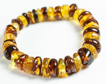 Luxury Baltic amber bracelet. Polished multicolor amber jewelry beads.