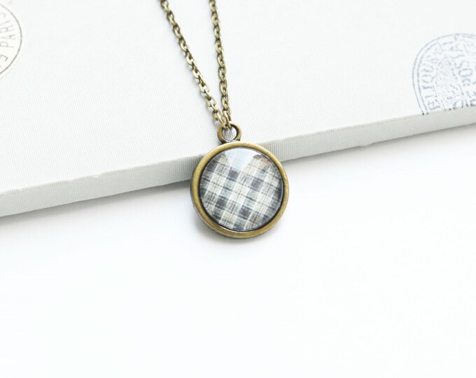 ART Round pendant metal brass with the image of a grey cells under glass