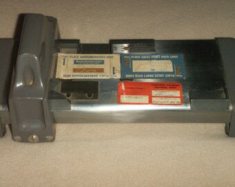 Credit Card manual swipe machine from 1964, original labels from