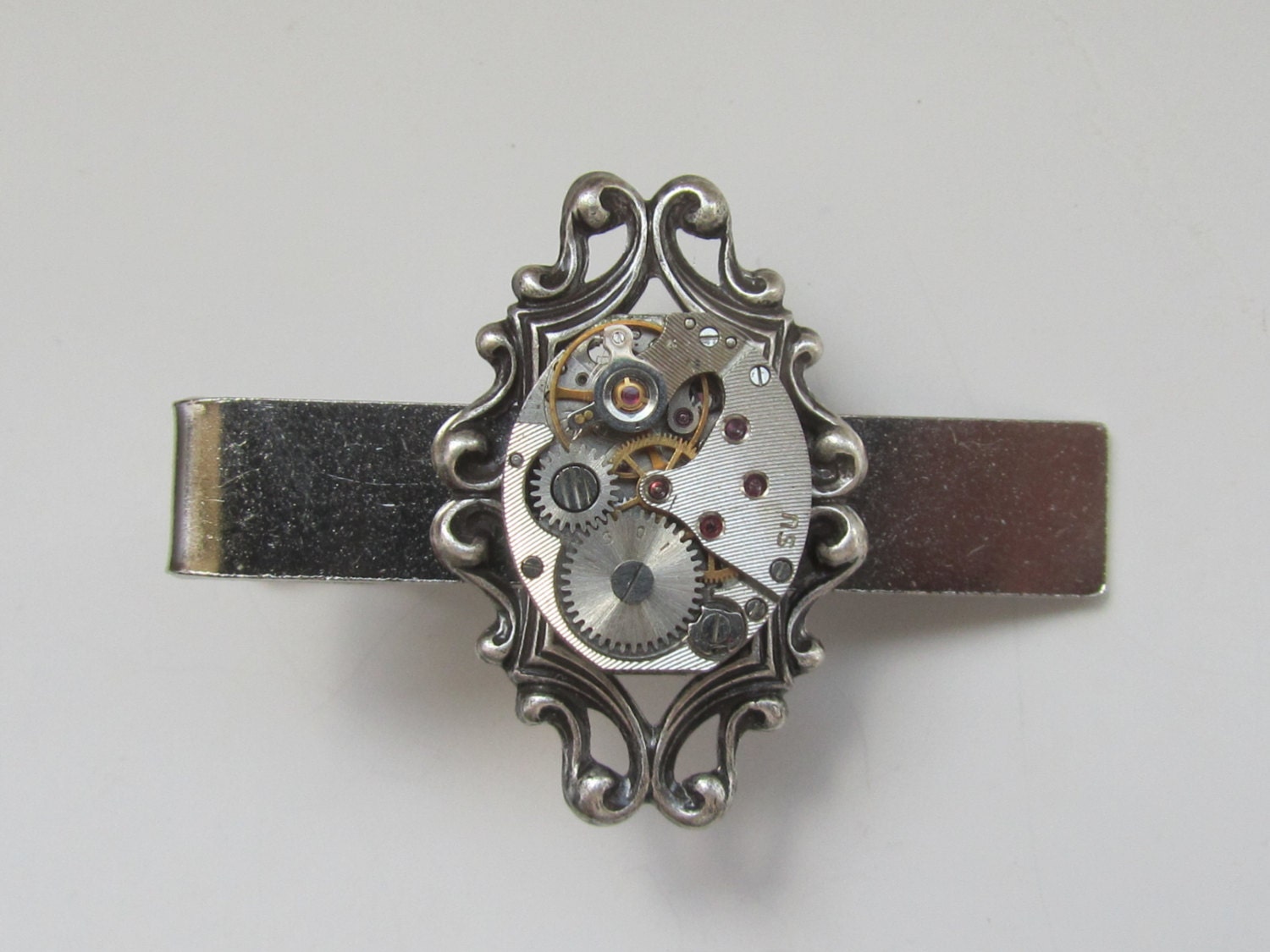 Steampunk Tie Clip with the smallest  oval vintage watch movement . Vintage upcycled mens Tie Tack, Industrial chic, Gift under 30 Dollars