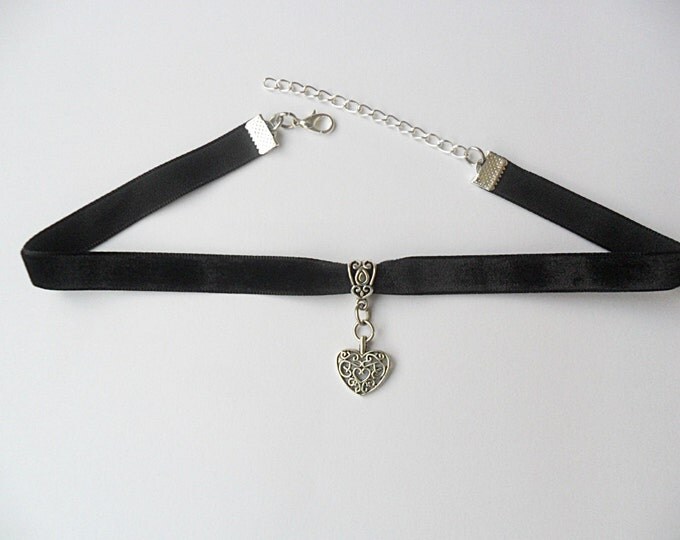 Black velvet choker necklace with tibetan silver heart pendant with a width of 3/8"inch.