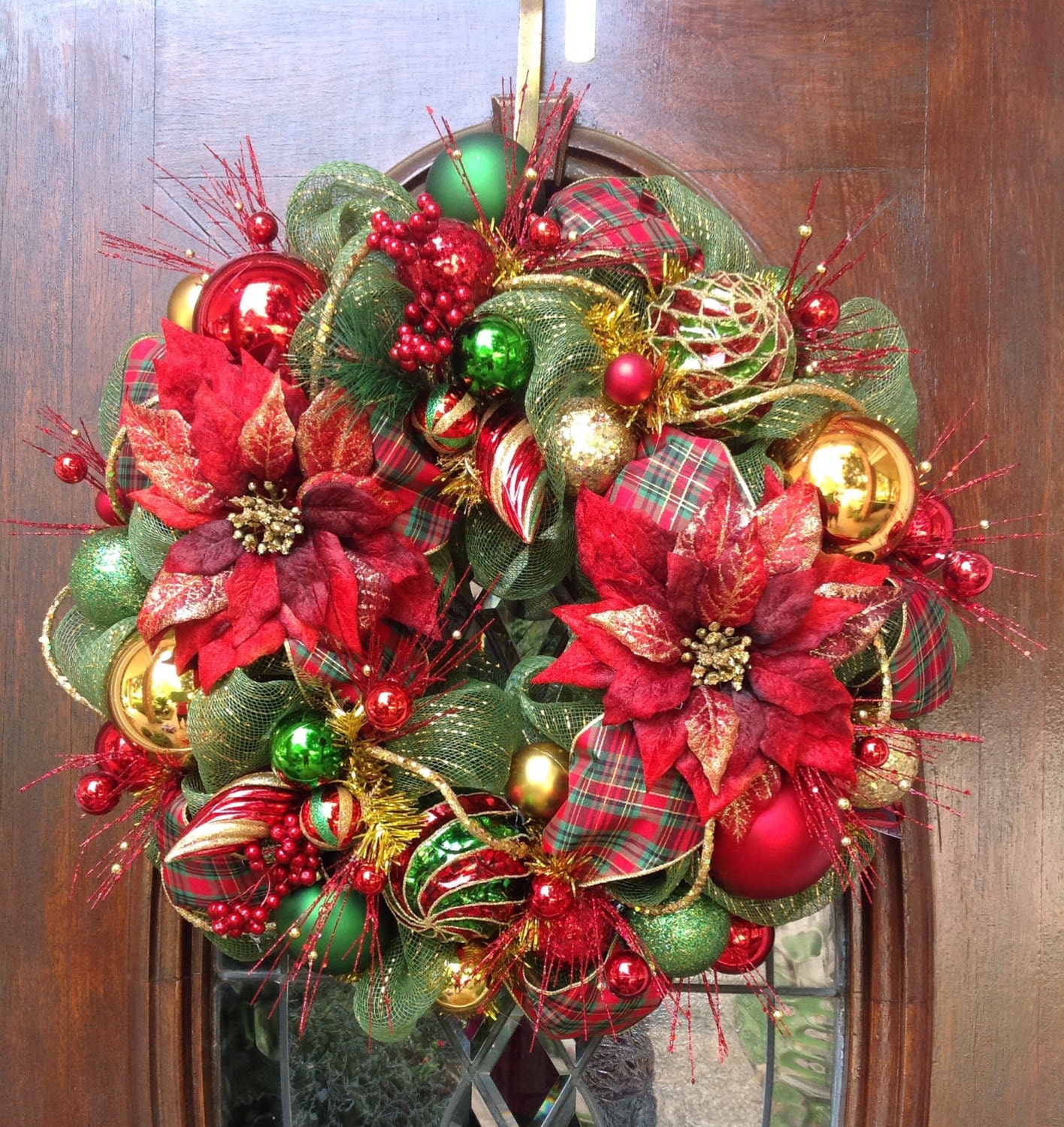 traditional christmas wreath with poinsettas traditional christmas wreath with poinsettas