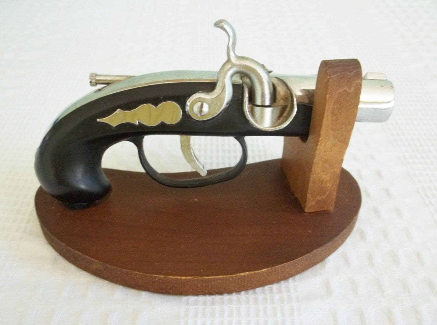 Vintage flinklock pistol gun lighter with wooden display