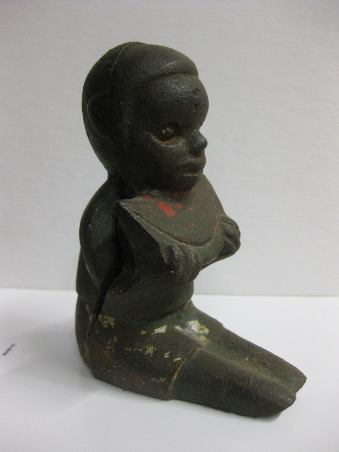 Black memorabilia cast iron boy eating watermelon figurine