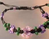Spring Azaleas  pink and lavender floral beaded micro macrame bracelet on black nylon cord.