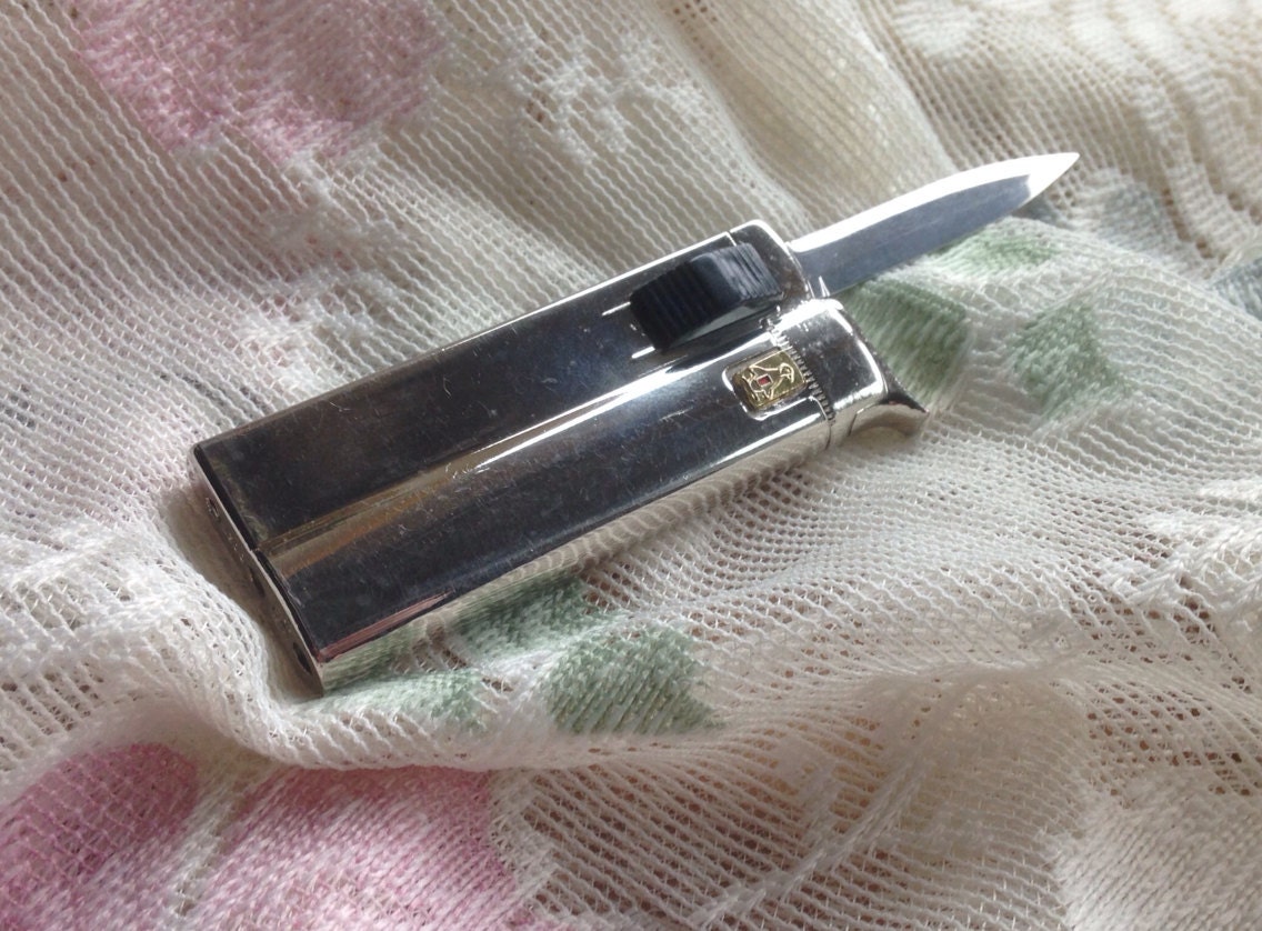 Vintage Penguin Switch Blade Knife Lighter by MarketValueSales