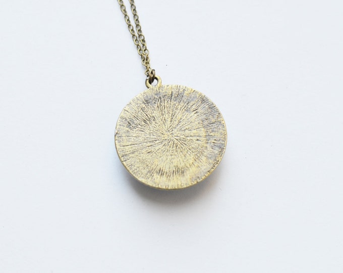 GALAXY Round pendant metal brass with the image of the space under the glass
