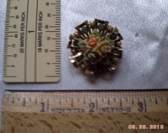 Coro goldtone starburst pin with ceramic roses in center