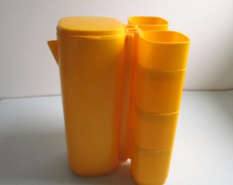 Plastic Stacking cups and Pitcher Set. Vintage 1970's Modern, Panton era. Mid century. Yellow.
