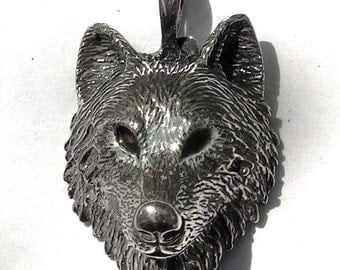 Sterling Silver Timber Wolf Pendant With Brown Eyes