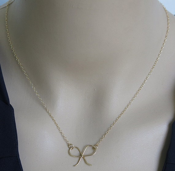 Items similar to Bow necklace, gold necklace, gold bow necklace, gold charm necklace, gold ...