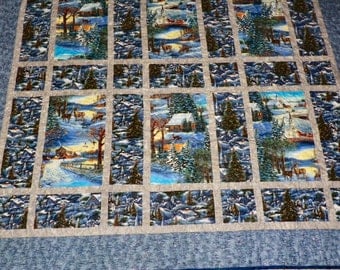 Winter scenery in a sparkley lap or throw quilt.