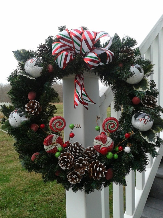 christmas wreath lit with battery operated red lights among christmas wreath lit with battery operated red lights among