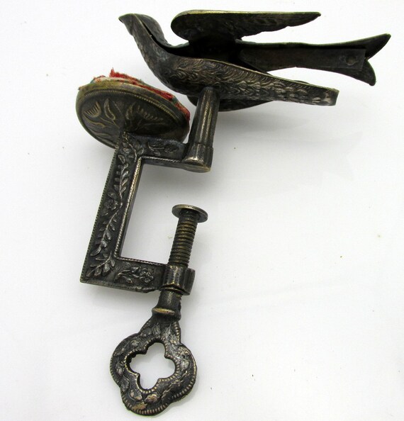 Antique Sewing Bird with Pin Cushion and Swing by antiquesarcadia