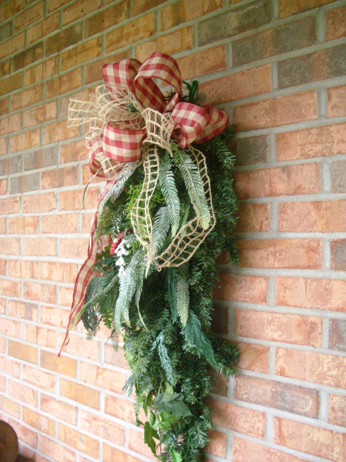Christmas teardrop swag made with red checked and burlap