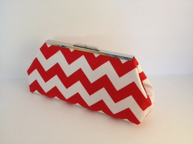 red and white clutch bag