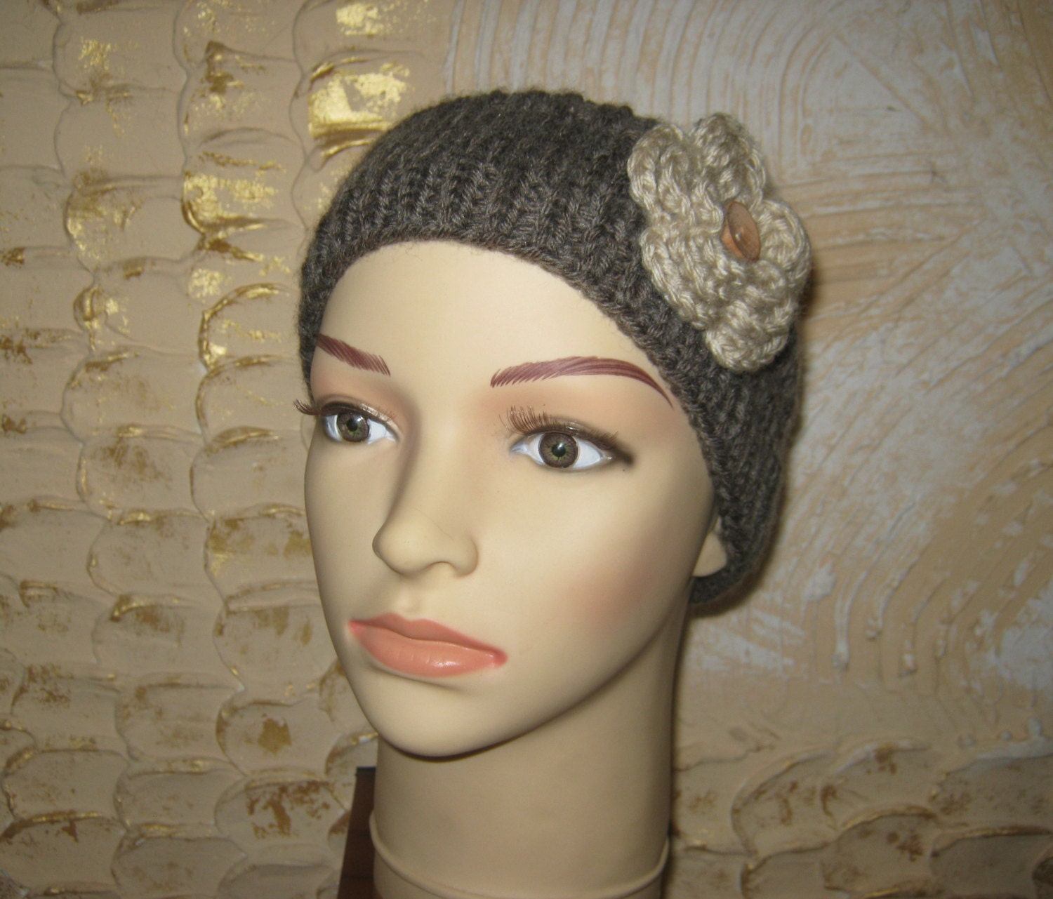Women knitted headband with flower. Knitted headband with