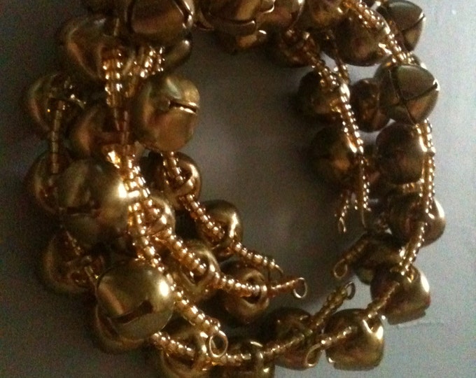 brass bells and gold glass stacking memory wire bracelet