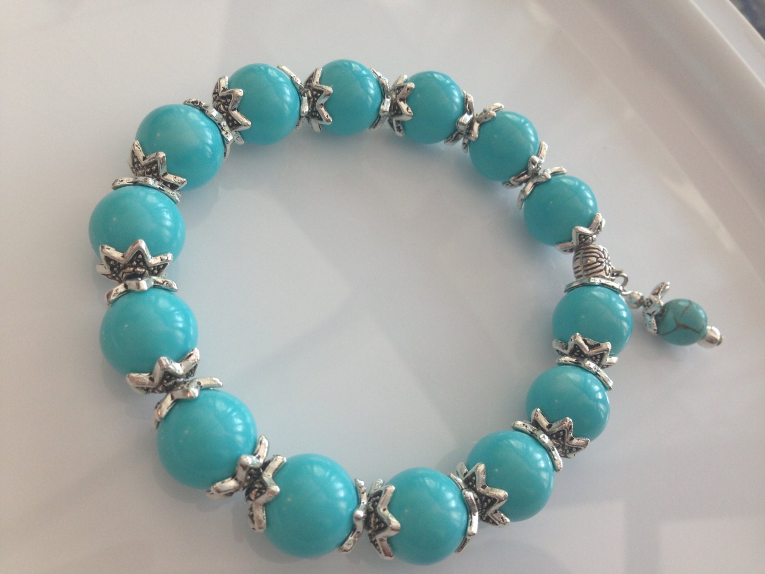 Turquoise glass bead and charm bracelet by GinasCreativeDesigns