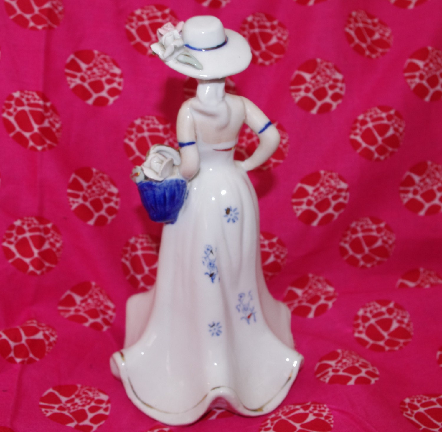 Blue and White Ceramic Figurine of Victorian Woman with Basket