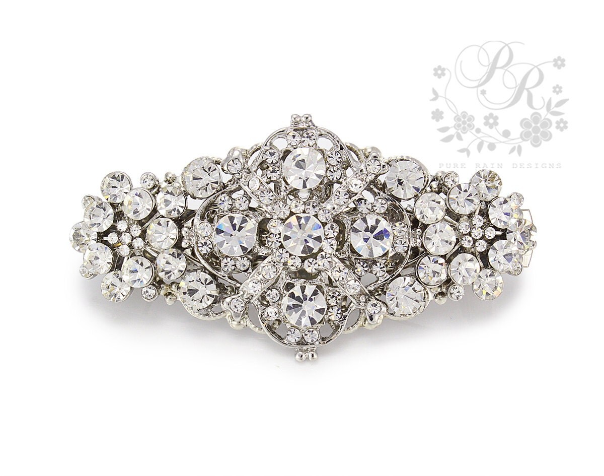 Rhinestone hair clip Add rhinestone flower hair accessories to any hair style to give it a striking unique look that no other hair accessories can achieve. You can choose something small such a barrette or go somewhat larger with a stunning hair clip.