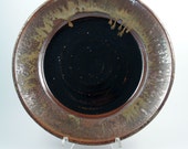 Black plate with copper brown rim