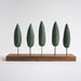 Small tabletop forest - miniature stand of cypress trees - green geometric trees