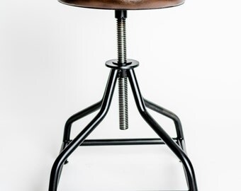 Handmade industrial swivel stool, steel and natural leather.