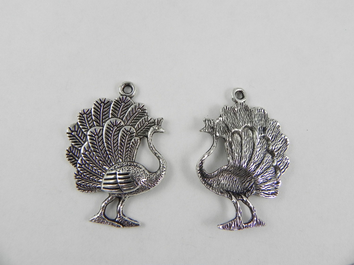 6 Peacock Charms in Antiqued Silver 35mm x 25mm from CraftersCorner