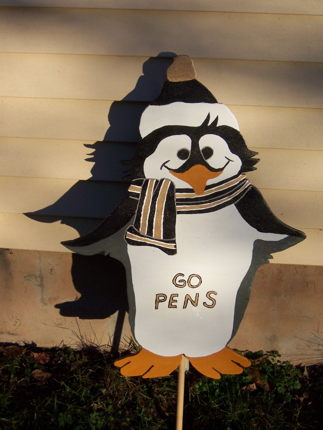 Handmade Custom painted penguin wearing a hat and scarf for your yard