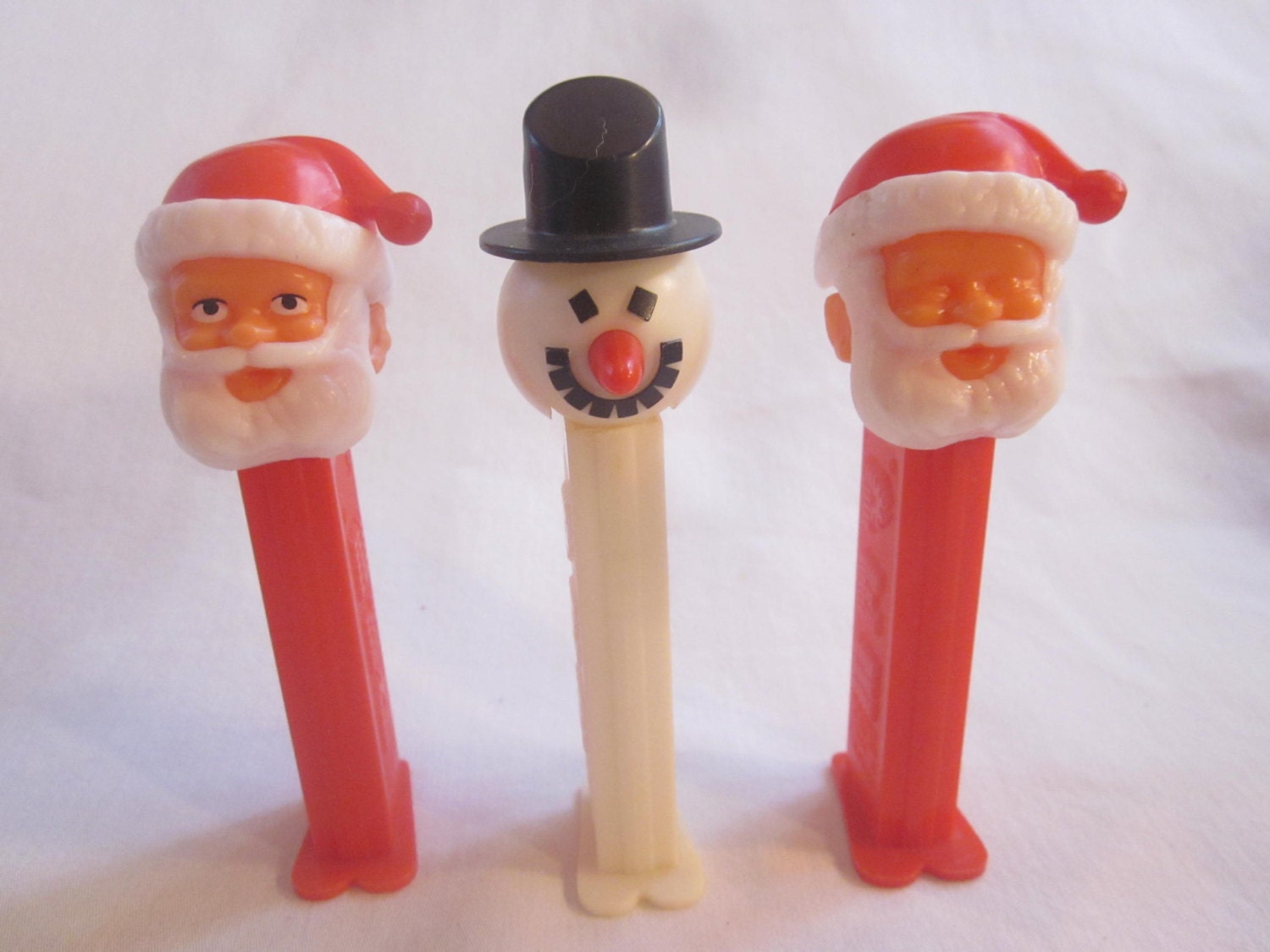 Christmas PEZ dispensers Santa eyes closed opened Snowman