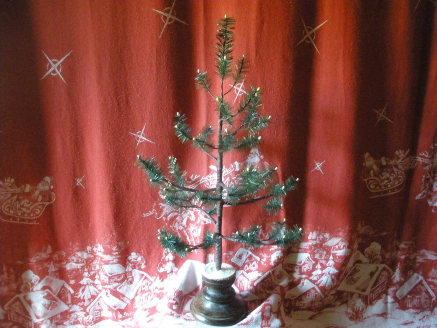 Little wild cedar feather tree. Perfect for an advent tree! This feather tree is unique - you won't find another one like it.