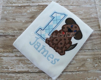 James & Lottie Boys Polo Shirt - Blue with Pink Puppy Dog main image 1