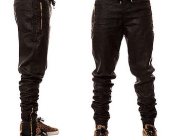 black leather joggers with gold zippers