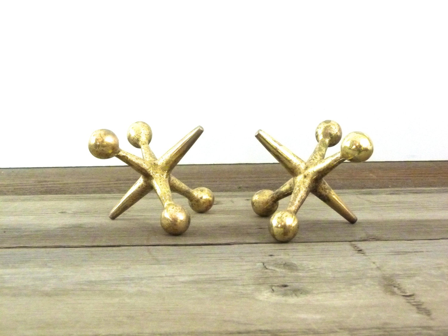 Vintage brass plated cast iron jacks sculptures/bookends