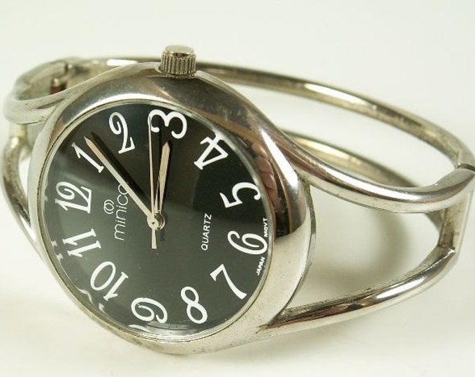 Storewide 25% Off SALE Vintage Ladies Silver Tone Minicci Designer Signed Quartz Watch Featuring Black Dial With Bracelet Style Band