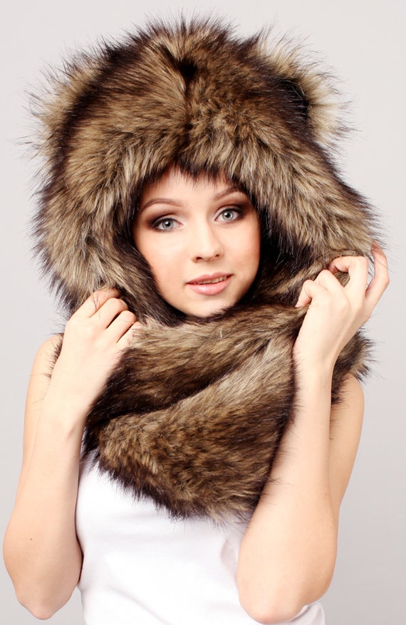 Shop by category faux fur hats found in: Dakota Bretton Faux Fur Hat, Cossack Faux Fur Hat, Wolverine Faux Fur Trapper Hat, Julie Fur Hat, Herringbone Wool Blend.. Skip to main content. VILLAGE HAT SHOP. hat with ears, a small shiny striped hat and hanging bows at the end of the tassels.